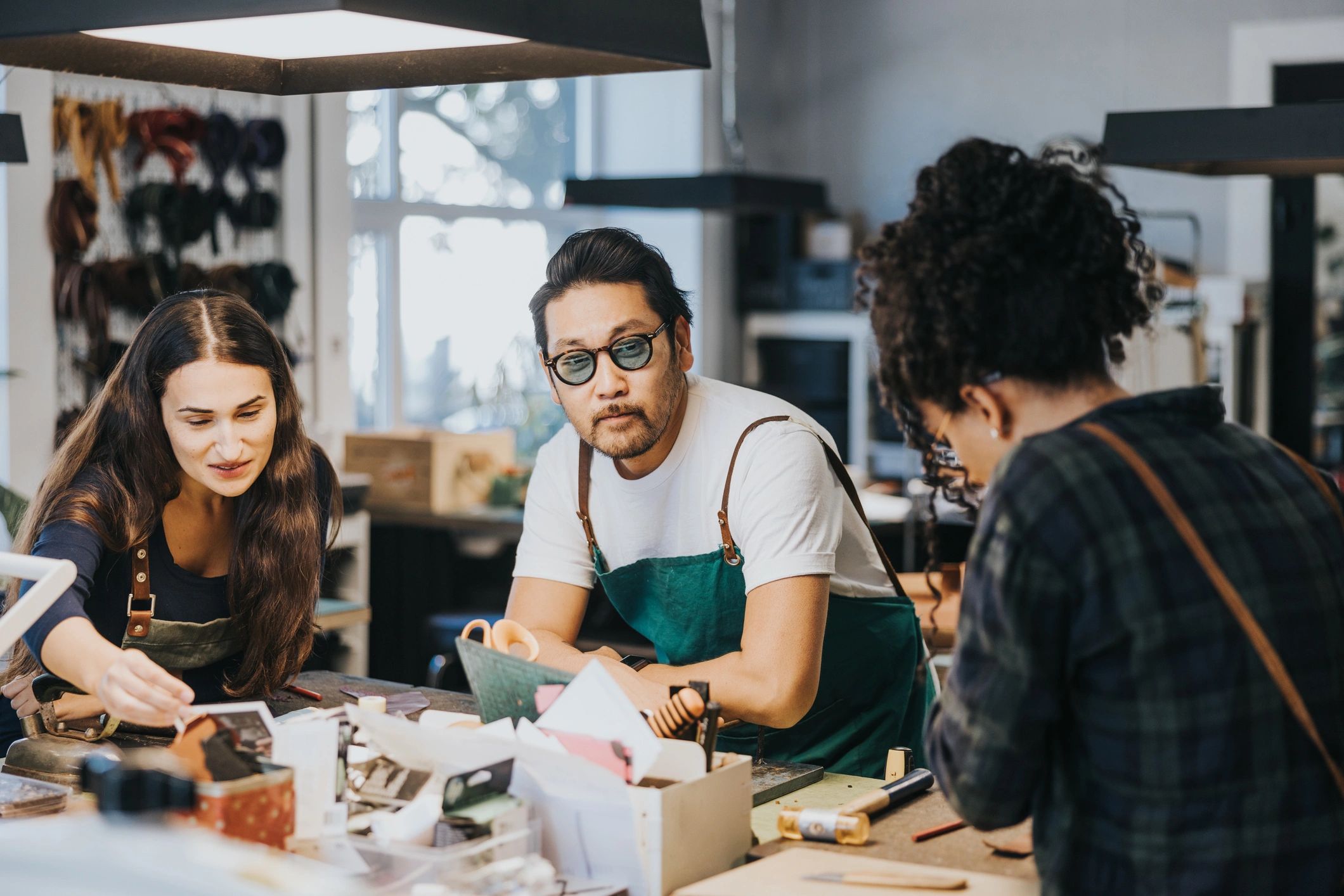 Creative makers working together in a bright workshop studio